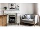 The fireplace has detailed tile and Audrey Hepburn portrait on the mantel at 214 E St Joseph St, Indianapolis, IN 46202