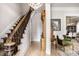 Grand foyer with hardwood floors, elegant staircase, crystal chandelier and vintage decor at 214 E St Joseph St, Indianapolis, IN 46202