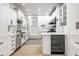 Modern kitchen with stainless steel appliances, white cabinets and wine cooler at 214 E St Joseph St, Indianapolis, IN 46202