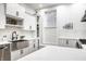 Bright kitchen with stainless steel appliances, white cabinets and hardware at 214 E St Joseph St, Indianapolis, IN 46202