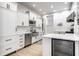 Bright kitchen with white cabinets, stainless steel appliances, and hardwood floors at 214 E St Joseph St, Indianapolis, IN 46202