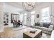 Open concept living space with dining area, large windows, and chandelier at 214 E St Joseph St, Indianapolis, IN 46202