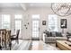 Open concept living space with dining area, large windows, and chandelier at 214 E St Joseph St, Indianapolis, IN 46202