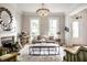 Bright living room with fireplace, stylish chandelier, and comfortable seating area at 214 E St Joseph St, Indianapolis, IN 46202