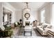 Bright living room featuring a decorative fireplace, vintage furniture, and an elegant chandelier at 214 E St Joseph St, Indianapolis, IN 46202
