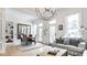Open concept living space with dining area, large windows, and chandelier at 214 E St Joseph St, Indianapolis, IN 46202