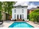 Gorgeous pool and outdoor entertaining space with relaxing seating and lush foliage at 214 E St Joseph St, Indianapolis, IN 46202