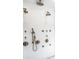 Modern shower with multiple showerheads, white herringbone tile, and sleek design at 214 E St Joseph St, Indianapolis, IN 46202