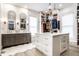 Spacious walk-in closet with center island, custom shelving, and vanity area at 214 E St Joseph St, Indianapolis, IN 46202