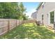 Grassy backyard area enclosed by a wooden fence, perfect for relaxation and outdoor activities at 265 Gathering Ln, Greenwood, IN 46143