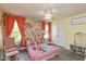 Charming bedroom with floral wallpaper, a pink princess bed, and ample natural light from the windows at 265 Gathering Ln, Greenwood, IN 46143