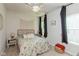 Cozy bedroom with a ceiling fan, natural light, and neutral decor at 265 Gathering Ln, Greenwood, IN 46143