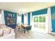 Dining area with stylish furniture, lighting and large sliding door at 265 Gathering Ln, Greenwood, IN 46143