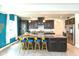 Spacious kitchen with center island, bar stool seating and stainless steel appliances at 265 Gathering Ln, Greenwood, IN 46143