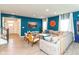 Stylish living room featuring an oversized sofa and bright blue accent wall at 265 Gathering Ln, Greenwood, IN 46143