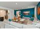 Comfortable living room area showcases modern furniture and decor adjacent to an open staircase at 265 Gathering Ln, Greenwood, IN 46143