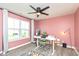 Home office with a large window, modern desk, and comfortable seating, ideal for work and study at 265 Gathering Ln, Greenwood, IN 46143
