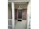 Covered front porch with brick accents, offering a welcoming entry to the home at 2734 Mingo Ct, Indianapolis, IN 46217