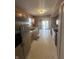 Functional kitchen boasts stainless steel appliances and seamless access to the dining area and backyard at 2734 Mingo Ct, Indianapolis, IN 46217