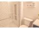 Modern bathroom showcasing a tiled shower with built-in shelving and a toilet at 2901 Hazel Foster Dr, Carmel, IN 46033