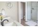 Modern bathroom featuring dual sinks, a glass-enclosed shower, and white subway tile at 2901 Hazel Foster Dr, Carmel, IN 46033