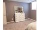 Cozy bedroom with a white dresser, mirror, soft carpet, and neutral wall color at 2901 Hazel Foster Dr, Carmel, IN 46033