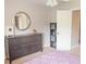 This is a bedroom with a dresser, mirror, and storage shelf at 2901 Hazel Foster Dr, Carmel, IN 46033