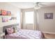 Inviting bedroom with bright window, accent wall, and comfortable bed with decorative pillows at 2901 Hazel Foster Dr, Carmel, IN 46033