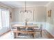 Bright dining room featuring a wooden table, stylish chairs, and a decorative chandelier at 2901 Hazel Foster Dr, Carmel, IN 46033