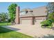 Exterior view of a brick home showing a three car garage and a basketball hoop in the driveway at 2901 Hazel Foster Dr, Carmel, IN 46033