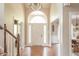 Bright and airy foyer featuring hardwood floors, a chandelier, and a view into adjacent rooms at 2901 Hazel Foster Dr, Carmel, IN 46033