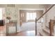 Welcoming foyer showcasing hardwood floors, staircase, and view into the cozy living room at 2901 Hazel Foster Dr, Carmel, IN 46033