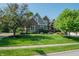 Charming brick two-story home featuring mature trees, lush landscaping, and a well-manicured lawn at 2901 Hazel Foster Dr, Carmel, IN 46033