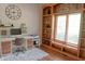 Well-lit home office features a built-in bookshelf and a comfortable workspace at 2901 Hazel Foster Dr, Carmel, IN 46033