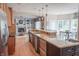 Spacious kitchen with a center island, granite countertops, and hardwood floors at 2901 Hazel Foster Dr, Carmel, IN 46033