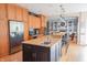 Open-concept kitchen features a large island, stainless steel appliances, and wooden cabinetry at 2901 Hazel Foster Dr, Carmel, IN 46033