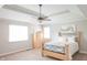 Bright and airy main bedroom with a tray ceiling, carpet floors, and a comfortable queen bed at 2901 Hazel Foster Dr, Carmel, IN 46033