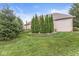 Expansive backyard features lush lawn and mature trees, providing a private outdoor space at 2920 Bloomsbury S, Greenwood, IN 46143