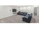 Finished basement featuring plush carpeting, comfortable seating, and a mounted television at 2920 Bloomsbury S, Greenwood, IN 46143