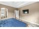 Comfortable bedroom with tray ceilings and an en-suite bathroom featuring a soaking tub at 2920 Bloomsbury S, Greenwood, IN 46143