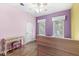 Bedroom showcasing hardwood floors, natural light from two windows, and a charming vanity at 2920 Bloomsbury S, Greenwood, IN 46143
