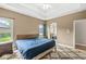 Cozy bedroom with tray ceilings, ample natural light, and an en-suite bathroom at 2920 Bloomsbury S, Greenwood, IN 46143