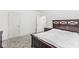 Comfortable bedroom with plush carpet and ample natural light from two doors at 2920 Bloomsbury S, Greenwood, IN 46143