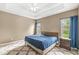 Comfortable bedroom with natural light, neutral walls, and tray ceilings at 2920 Bloomsbury S, Greenwood, IN 46143
