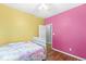 Comfortable bedroom featuring hardwood floors, a ceiling fan, and a cozy bed at 2920 Bloomsbury S, Greenwood, IN 46143