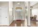 Bright foyer featuring hardwood floors, arched doorways, and a view into the dining area at 2920 Bloomsbury S, Greenwood, IN 46143