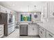 Kitchen featuring stainless steel appliances, granite countertops, and an open dining area with natural light at 2920 Bloomsbury S, Greenwood, IN 46143