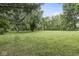 Expansive backyard with lush green grass and mature trees providing privacy and a peaceful setting at 3090 N County Road 800 E Rd, Brownsburg, IN 46112
