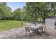 Large backyard patio with dining furniture creating an ideal setting for outdoor gatherings and relaxation at 3090 N County Road 800 E Rd, Brownsburg, IN 46112