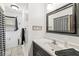 Stylishly updated bathroom offers a sleek vanity, modern fixtures, and tiled flooring at 3090 N County Road 800 E Rd, Brownsburg, IN 46112